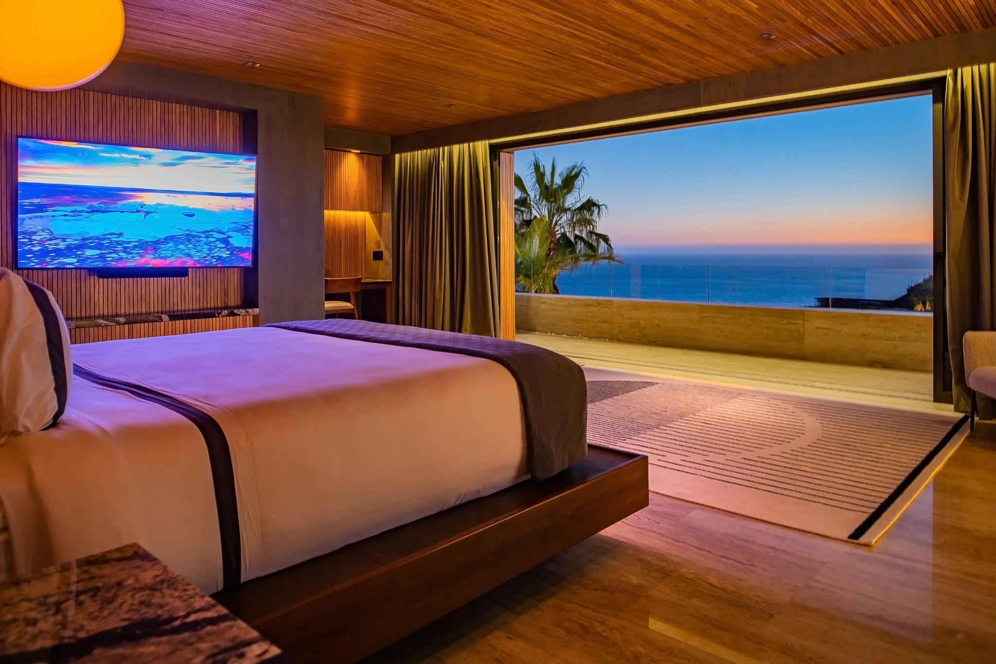 Ocean-facing bedroom at sunset