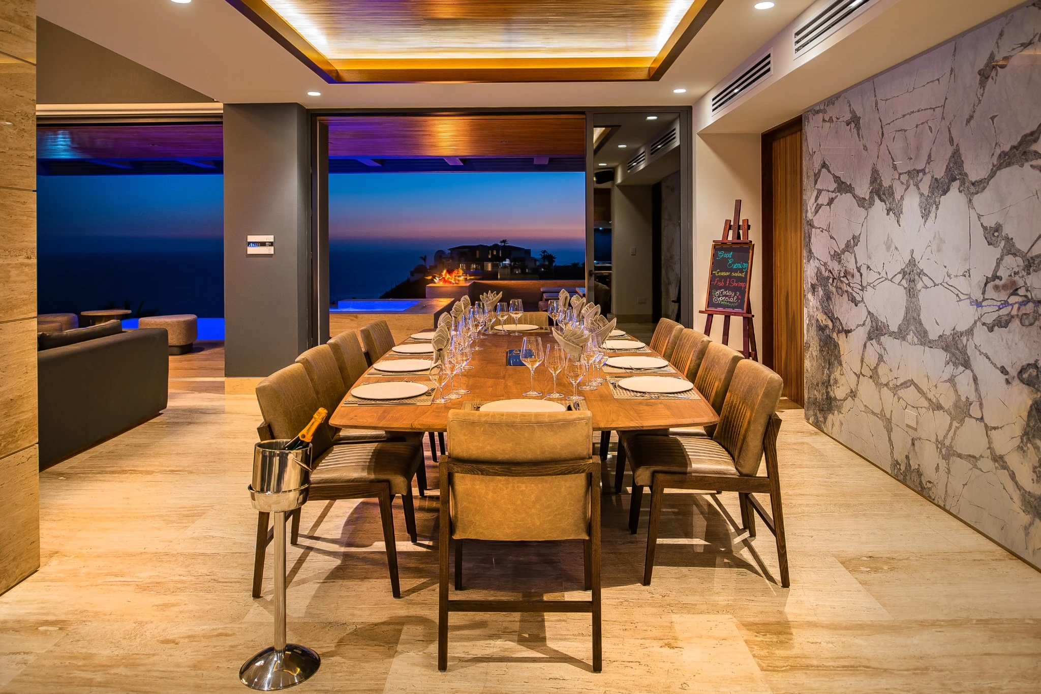 Dining room looking toward the terrace and evening horizon