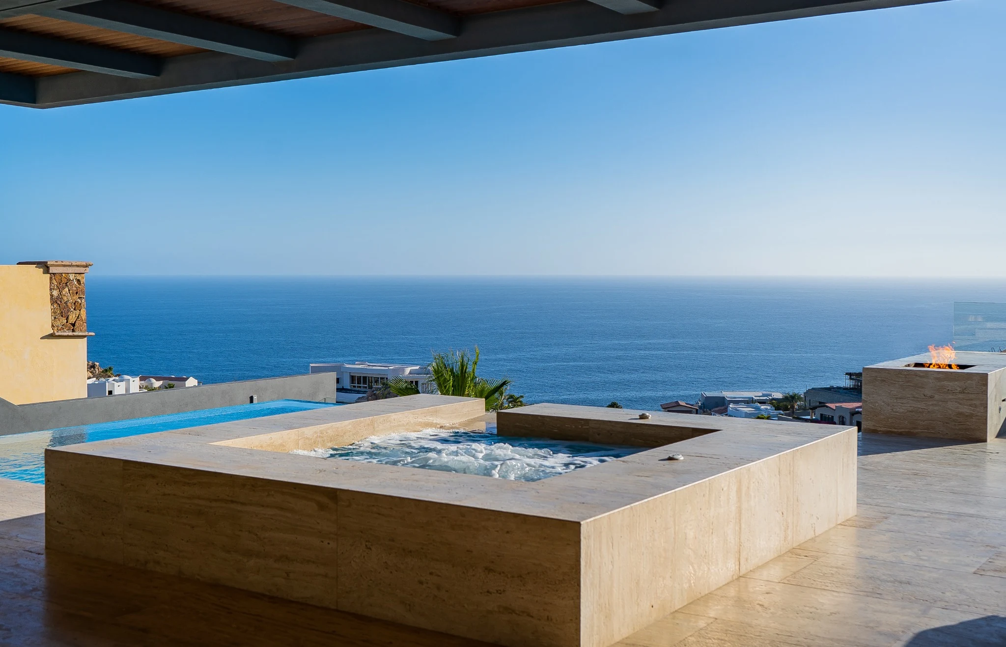 Spa pool and ocean-facing terrace in daylight