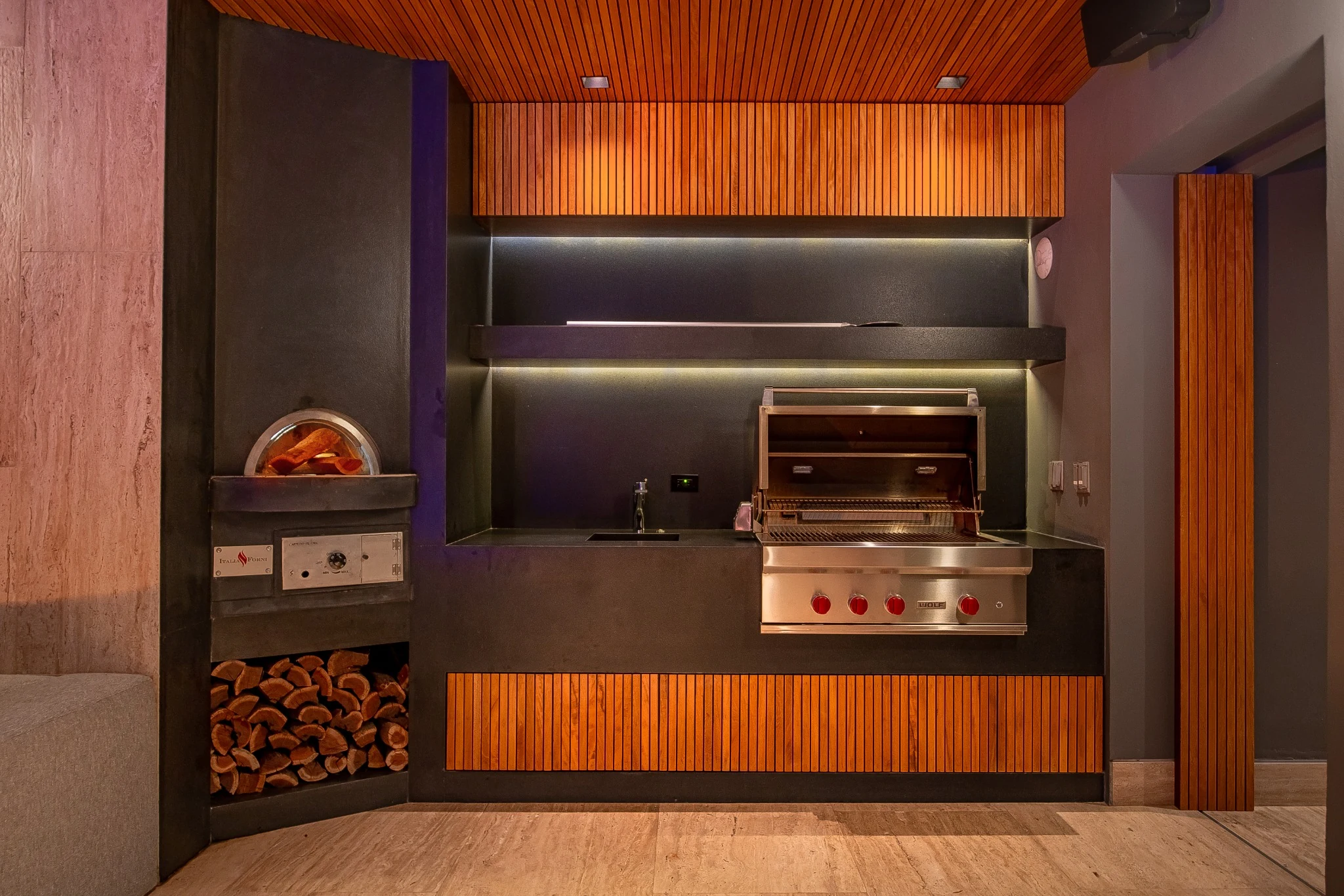 Outdoor kitchen with pizza oven and grill
