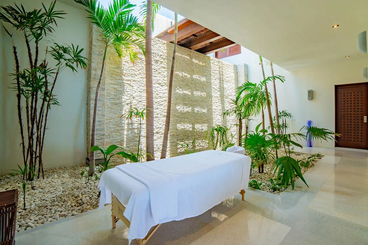 Massage room beside a planted courtyard