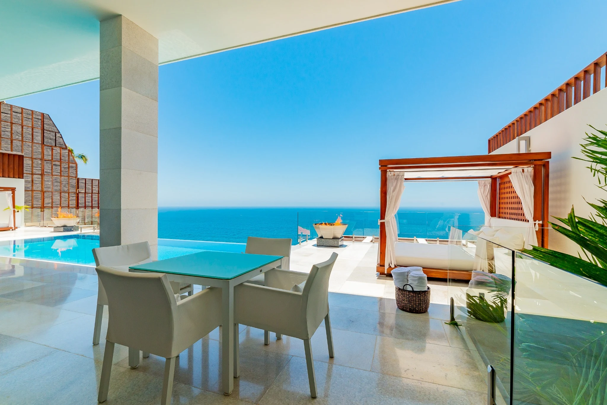 Shaded terrace dining beside the pool